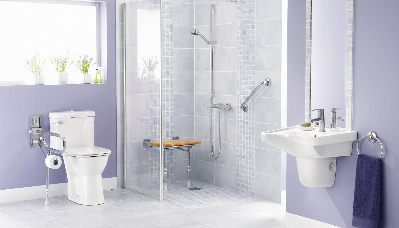 Purple bathroom with toilet, shower, and sink with different types of bathroom safety equipment
